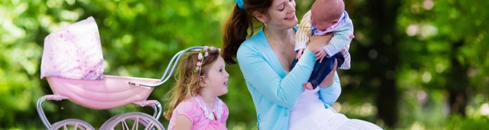 Mother And Kids Enjoying Staycation Picnic Outdoors